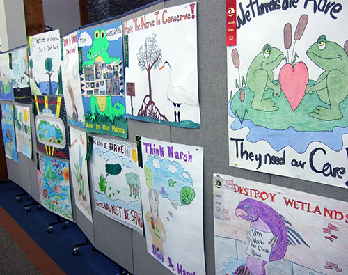 Macon County Library display wall with student art
